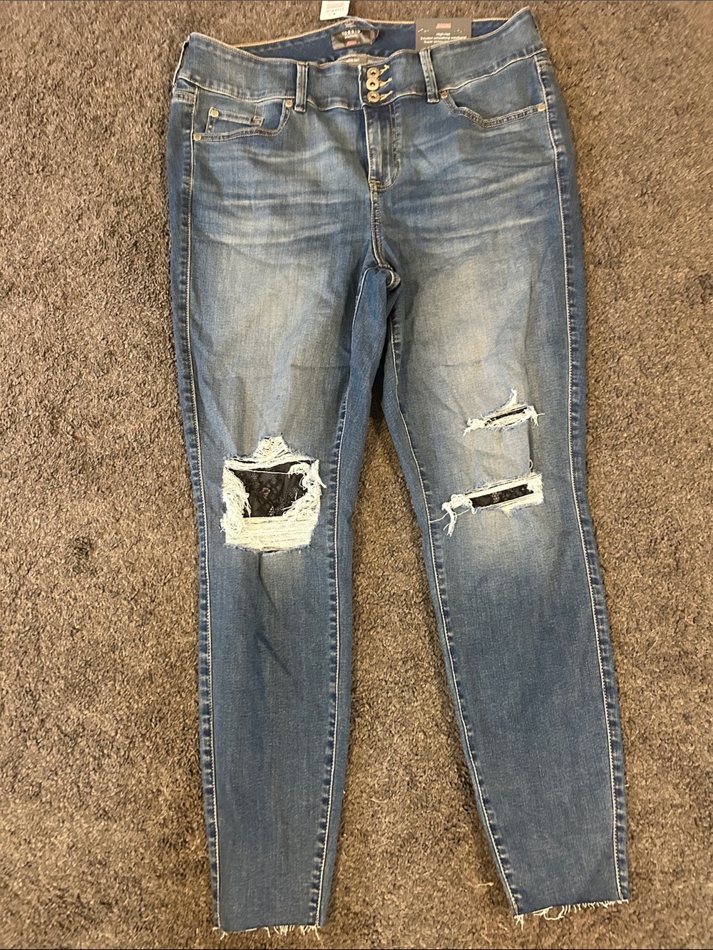 Women’s Distressed Blue Skinny Jeans with lace detailing in rips